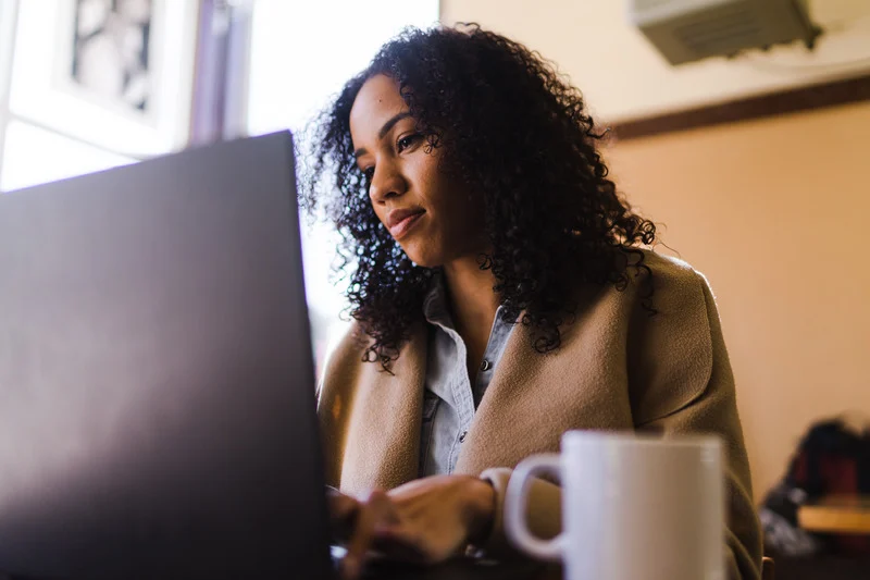 Woman on laptop in café